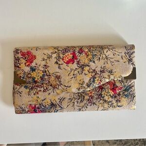 Super cute floral clutch with gold accent and gold leaf